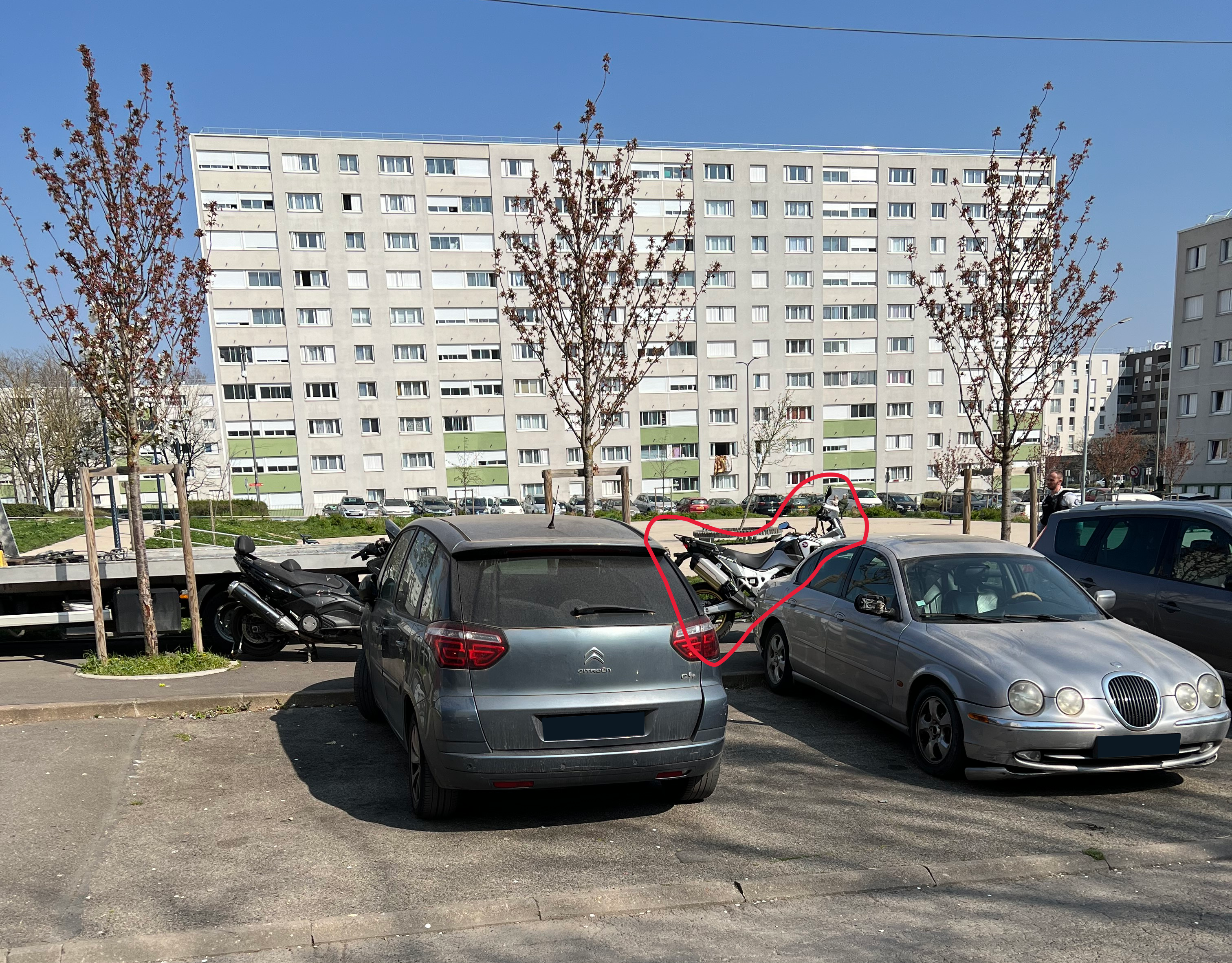 Motorbike found in plain sight behind a car